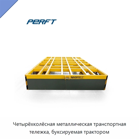 Четырёхколёсная металлическая транспортная тележка, буксируемая трактором